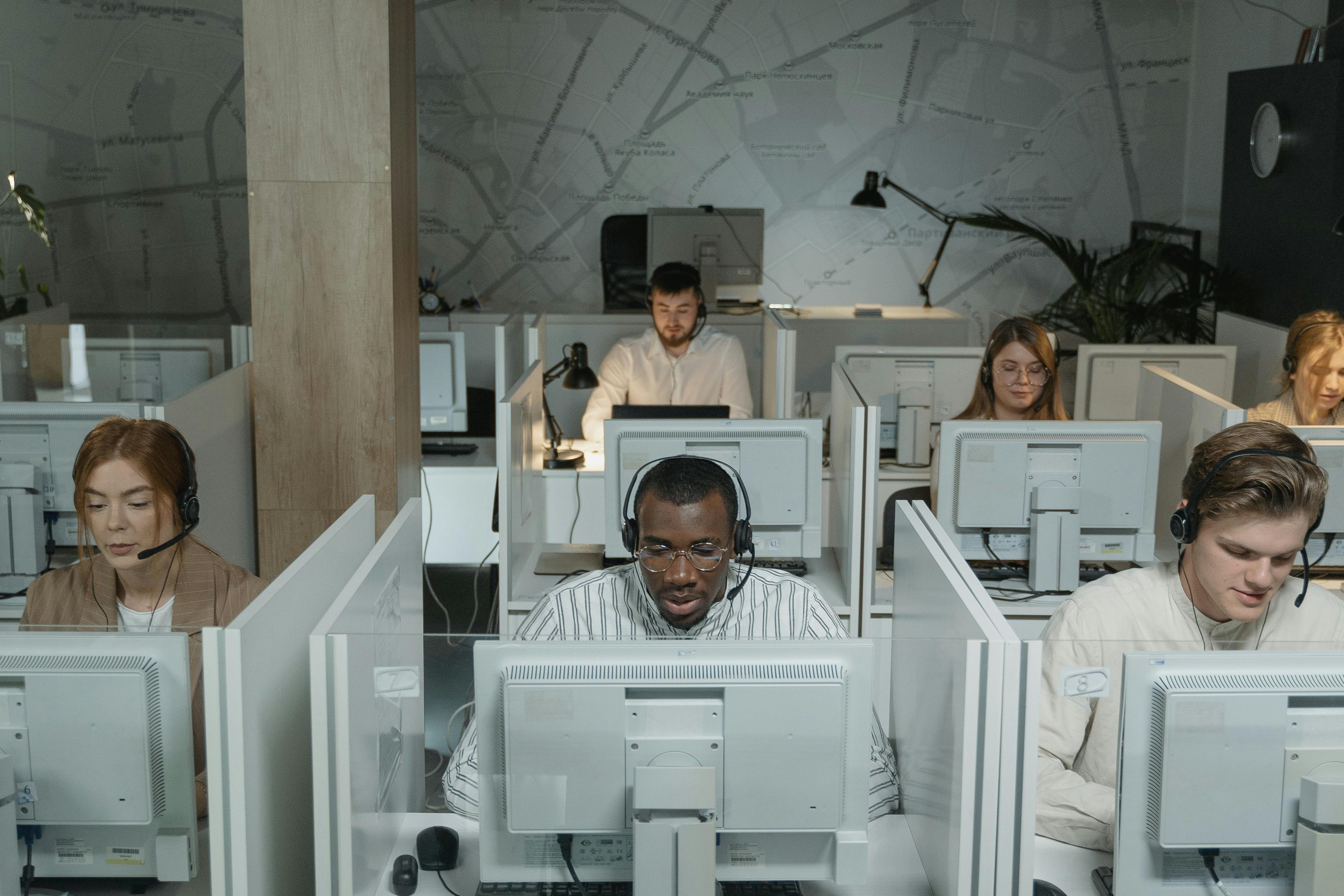 people working in call center office