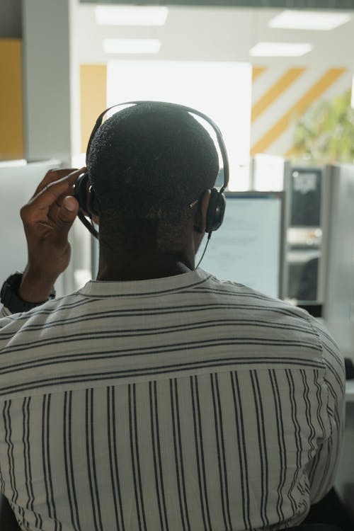 Free Man in Black and White Stripe Shirt Wearing Black Headphones Stock Photo