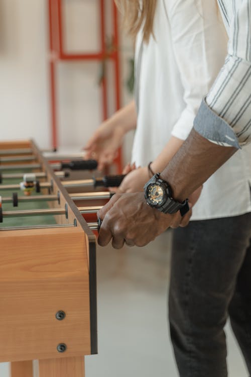 Person using Table Football
