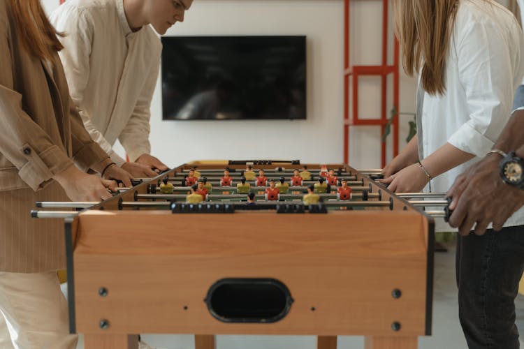 Friends Playing Foosball