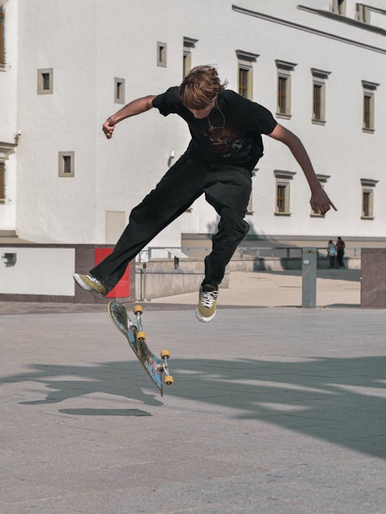 Boy Jumping on Skateboard · Free Stock Photo