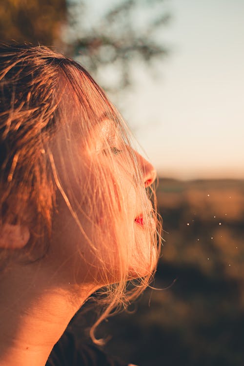 Side View of  Woman's Face with her Eyes Closed 