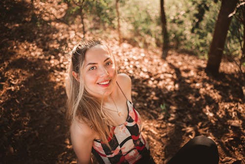 Smiling Woman in Forest