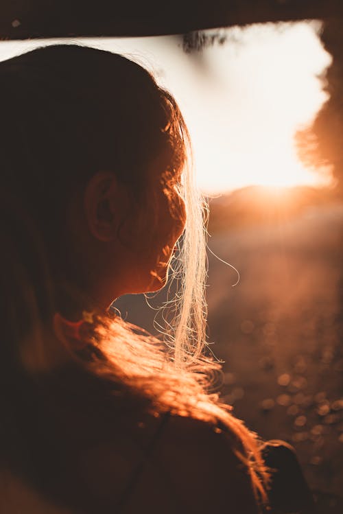 Free Woman Looking at Sunset Stock Photo