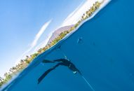 People Surfing on Sea