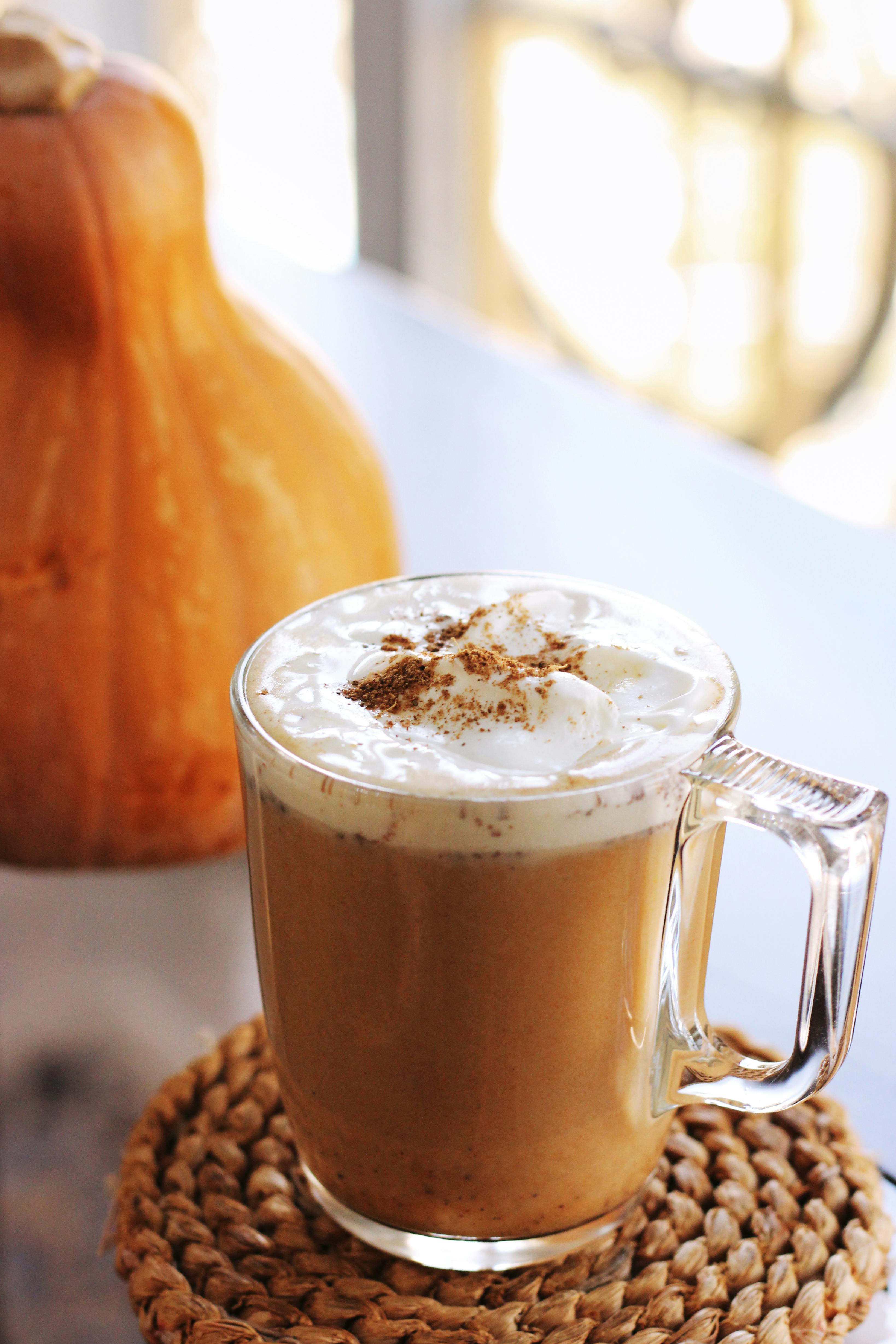 Delicious pumpkin spice latte topped with whipped cream, perfect for autumn indulgence.