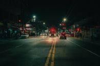 Night city street with traffic on road