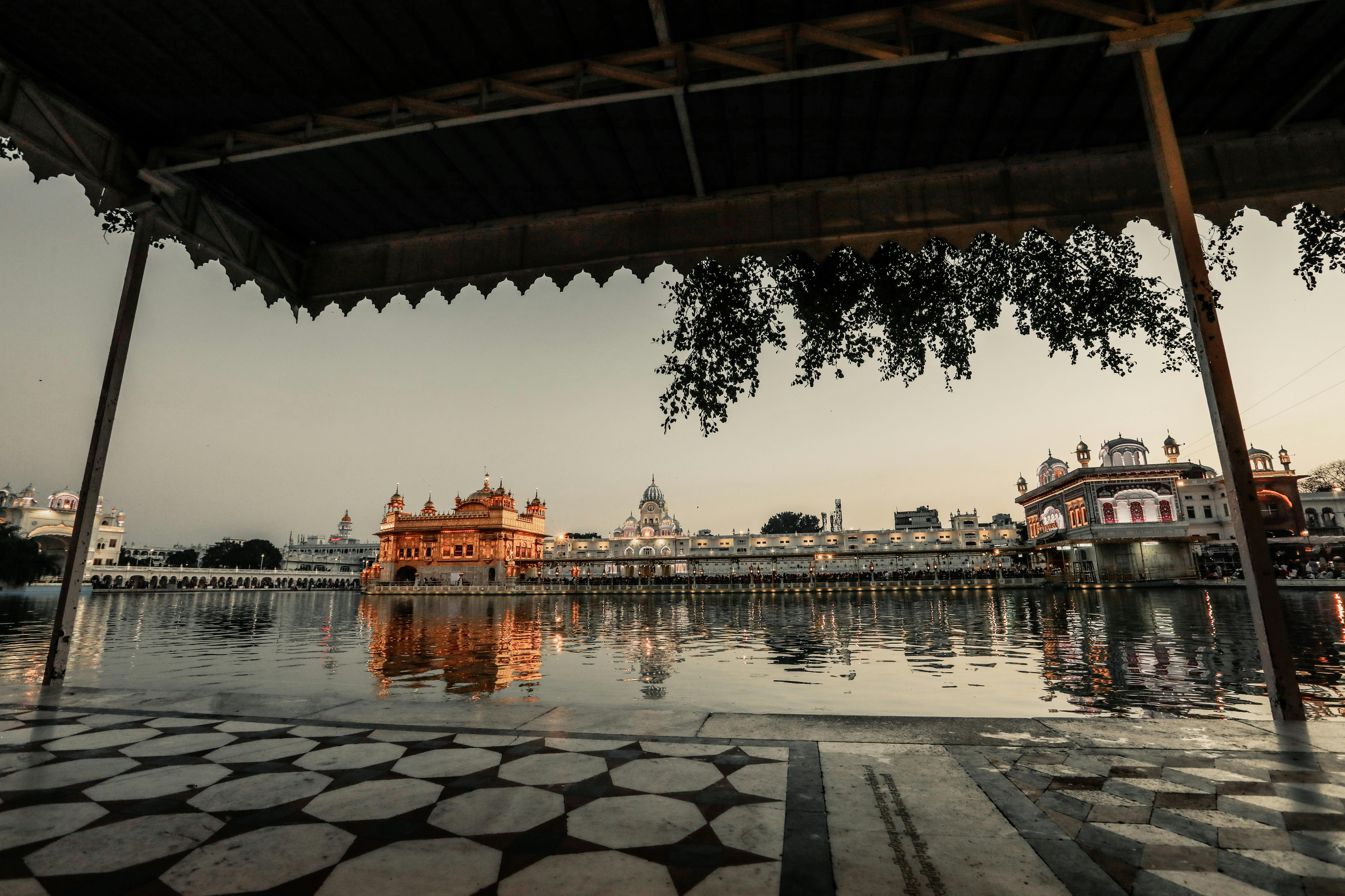 old temple near water in evening