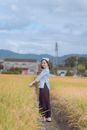Girl in Old Fashion Clothing Posing on a Field