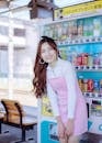 Woman Standing near the Vending Machine