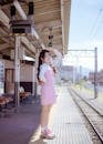 Girl in Dress Posing on Train Platform