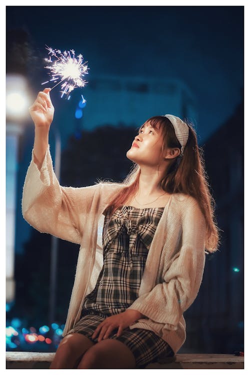 Woman Holding a Sparkler
