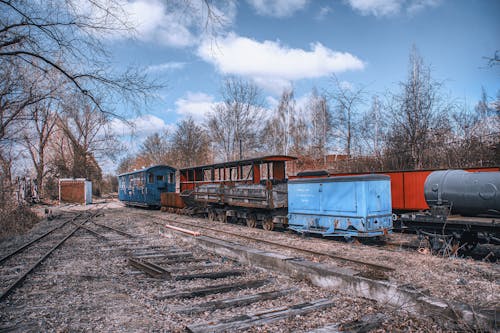 Abandoned Train Near Bare Trees
