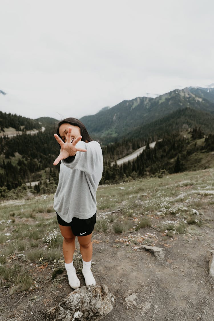 Woman In Sportswear On Mountain Top