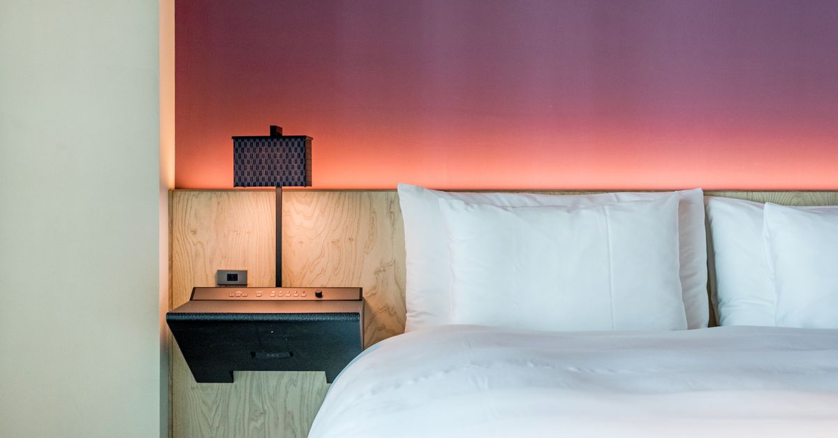 sleep tracking technology on bedside table in hotel room