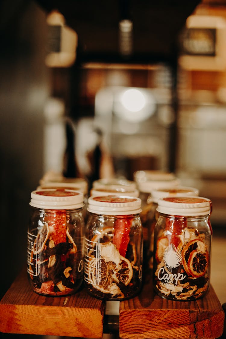 Jars With Dried Fruits On Cafe Shelf