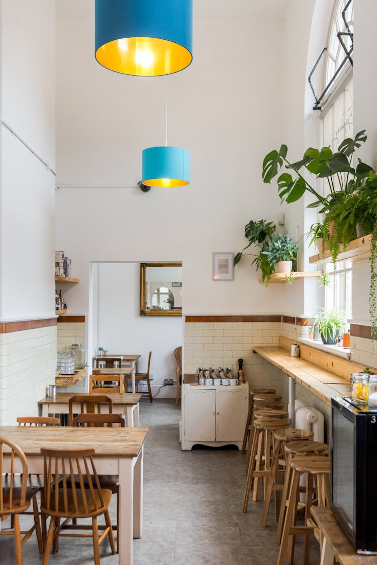 An Eatery With Wooden Tables And Chairs