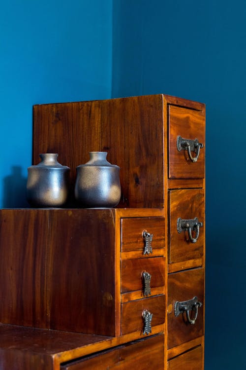 Brown Wooden Cabinet in a Blue Room