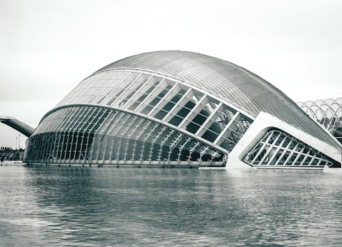 Gray Concrete Building Near Body of Water