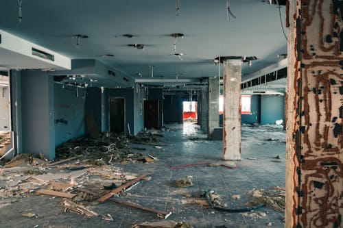 Free Abandoned Building with Trash Inside Stock Photo