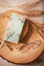 Ladies 2021 year diary and eyeglasses on wooden boards