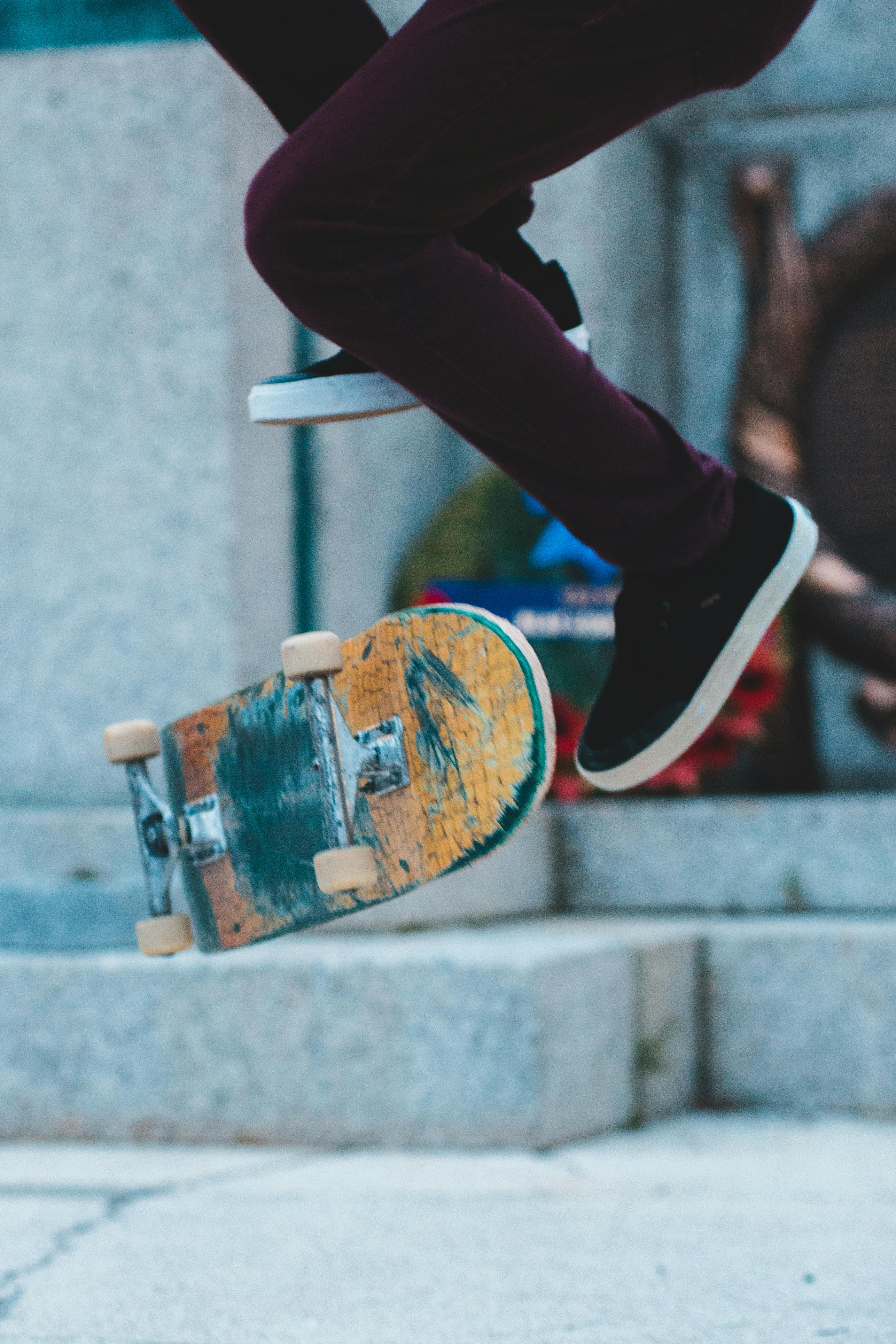 Crop skater jumping on skateboard · Free Stock Photo