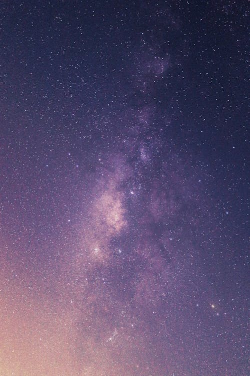 Free A Night Sky Filled with Bright Stars and Dust Stock Photo