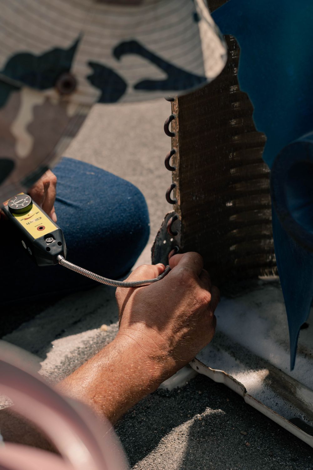 Climate Care technician servicing HVAC unit