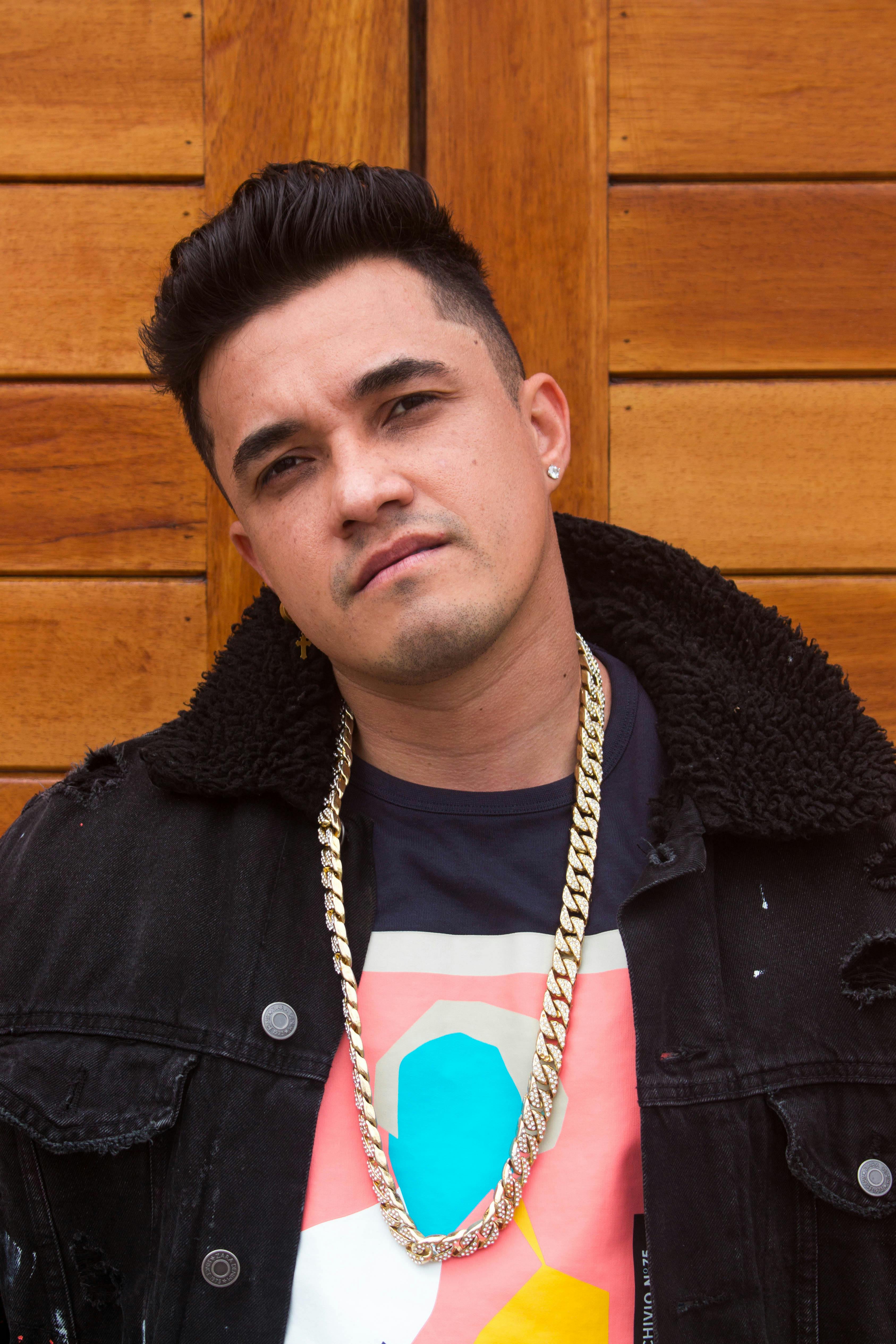 Man in Black Jacket Wearing Gold Chain Necklace · Free Stock Photo