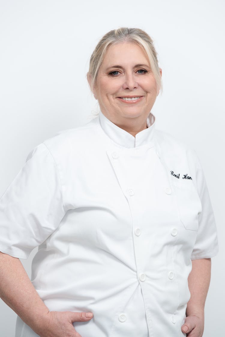 A Woman In A White Short Sleeve Chef Uniform