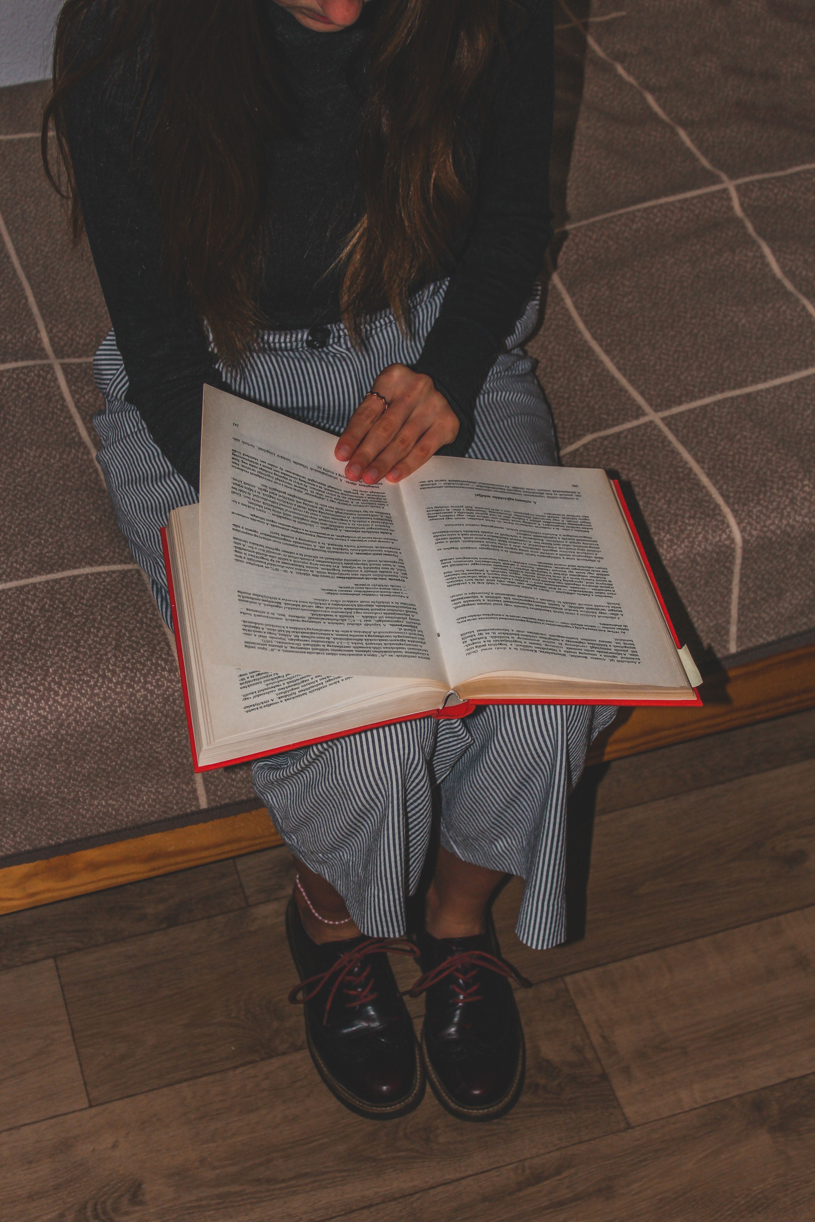 Portrait of author June Calloway reading indoors