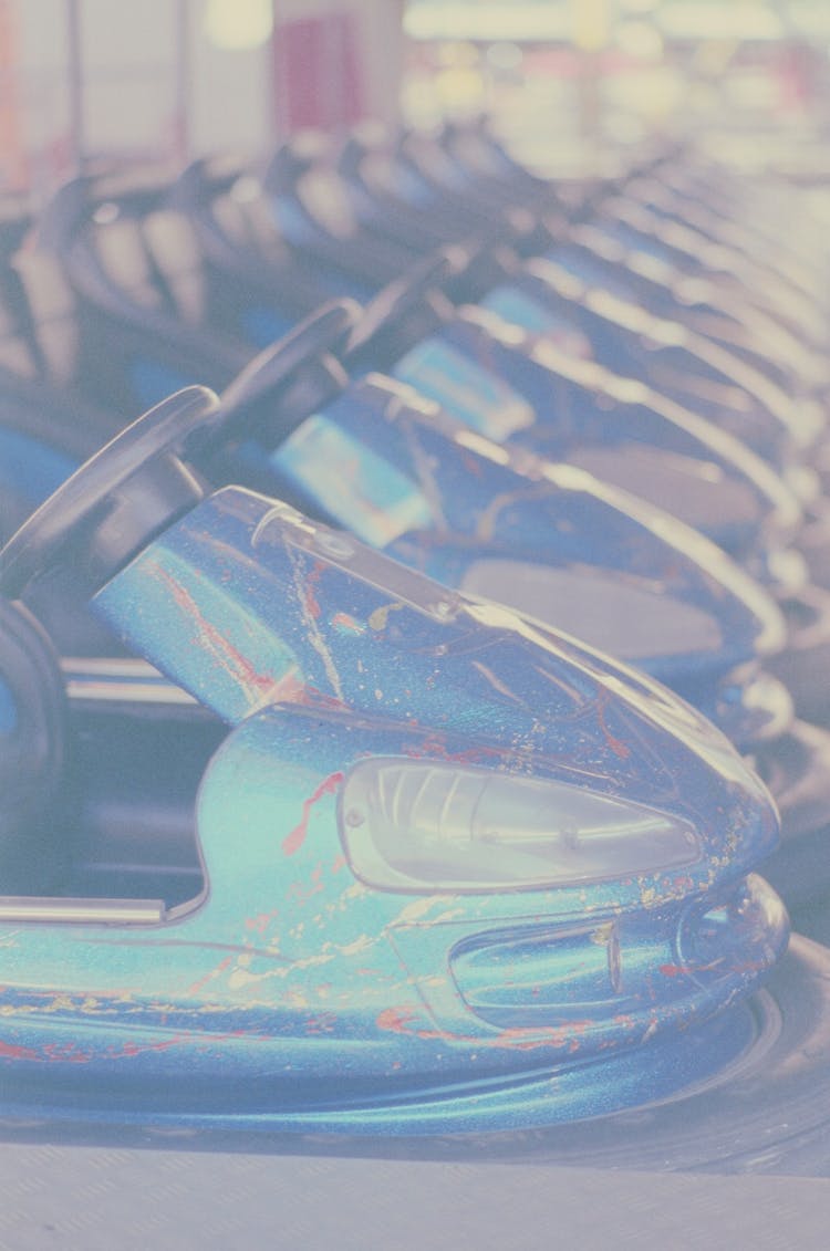 Blue Bumper Cars With Black Steering Wheels