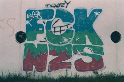 Colorful graffiti art displayed on an urban wall, showcasing bold street expression.