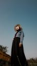 Woman in Gray Coat Standing Near Green Tree