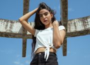 Woman in White Sleeveless Shirt and Blue Denim Shorts