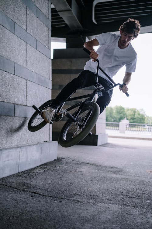 Free Man Jumping a Bike in the Air Stock Photo