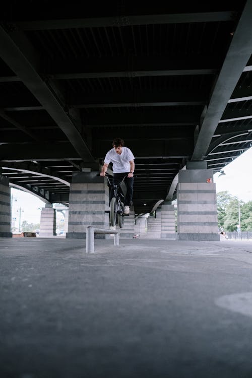 Man Riding a Bike on a Railing