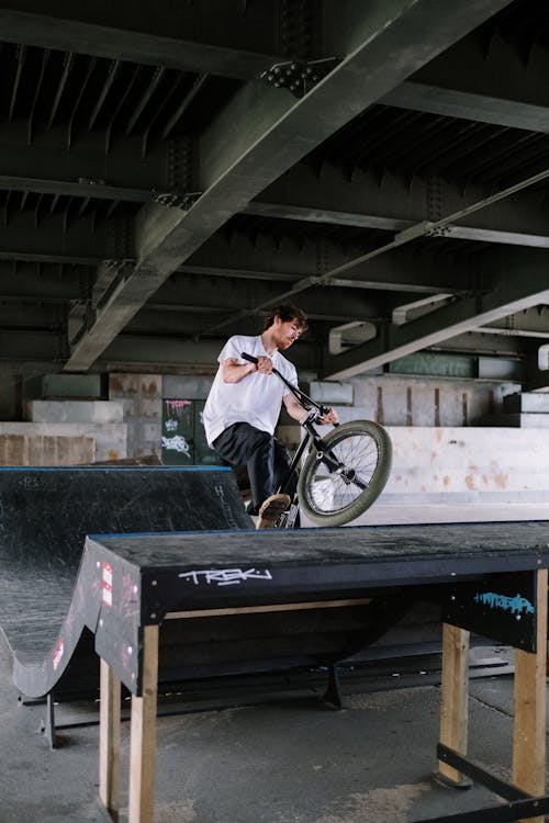 Man Riding a Bike on a Ramp