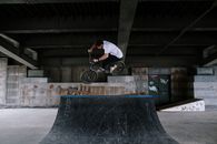 Man in White Shirt Riding Bicycle