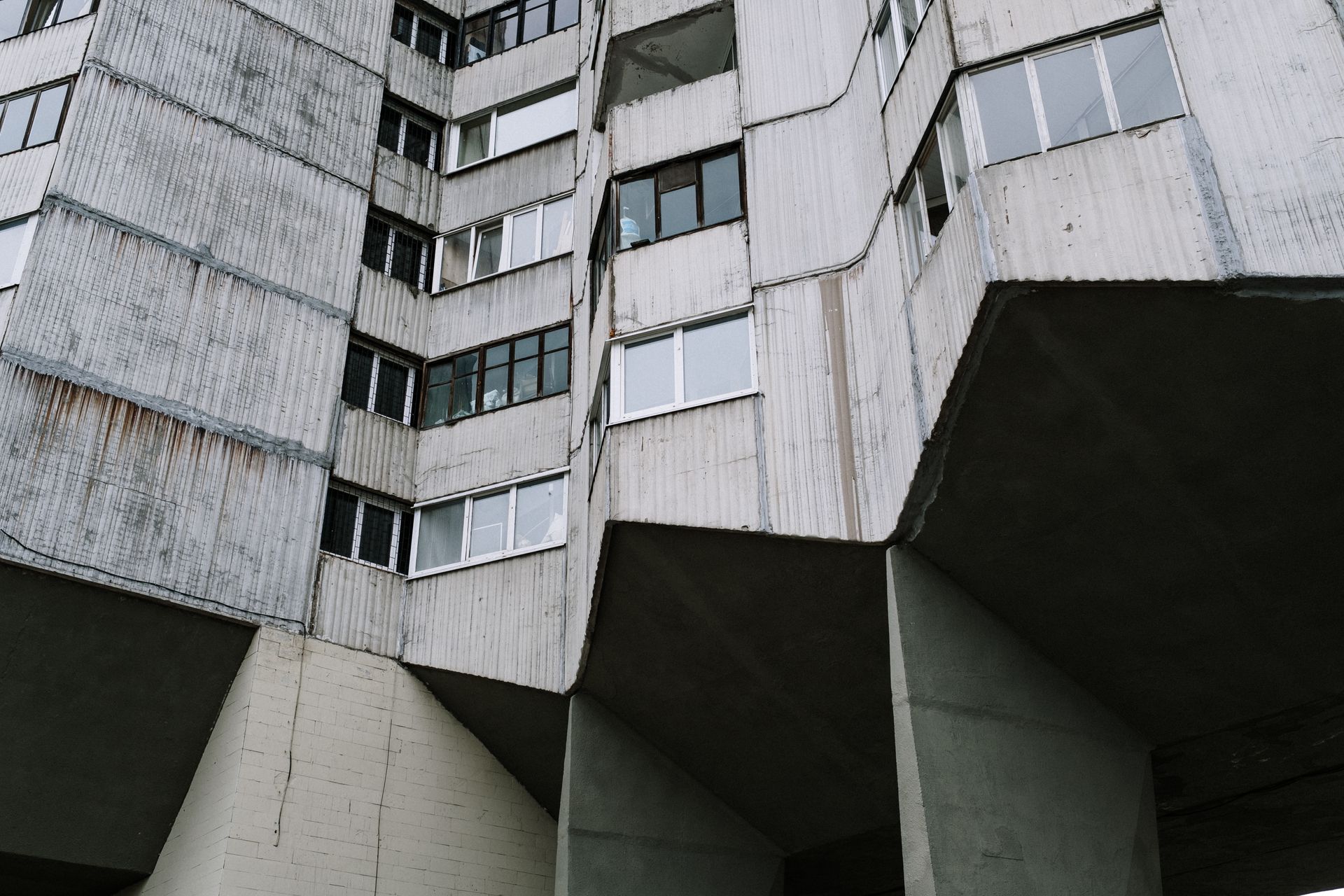 Modern residential building with balconies at golden hour