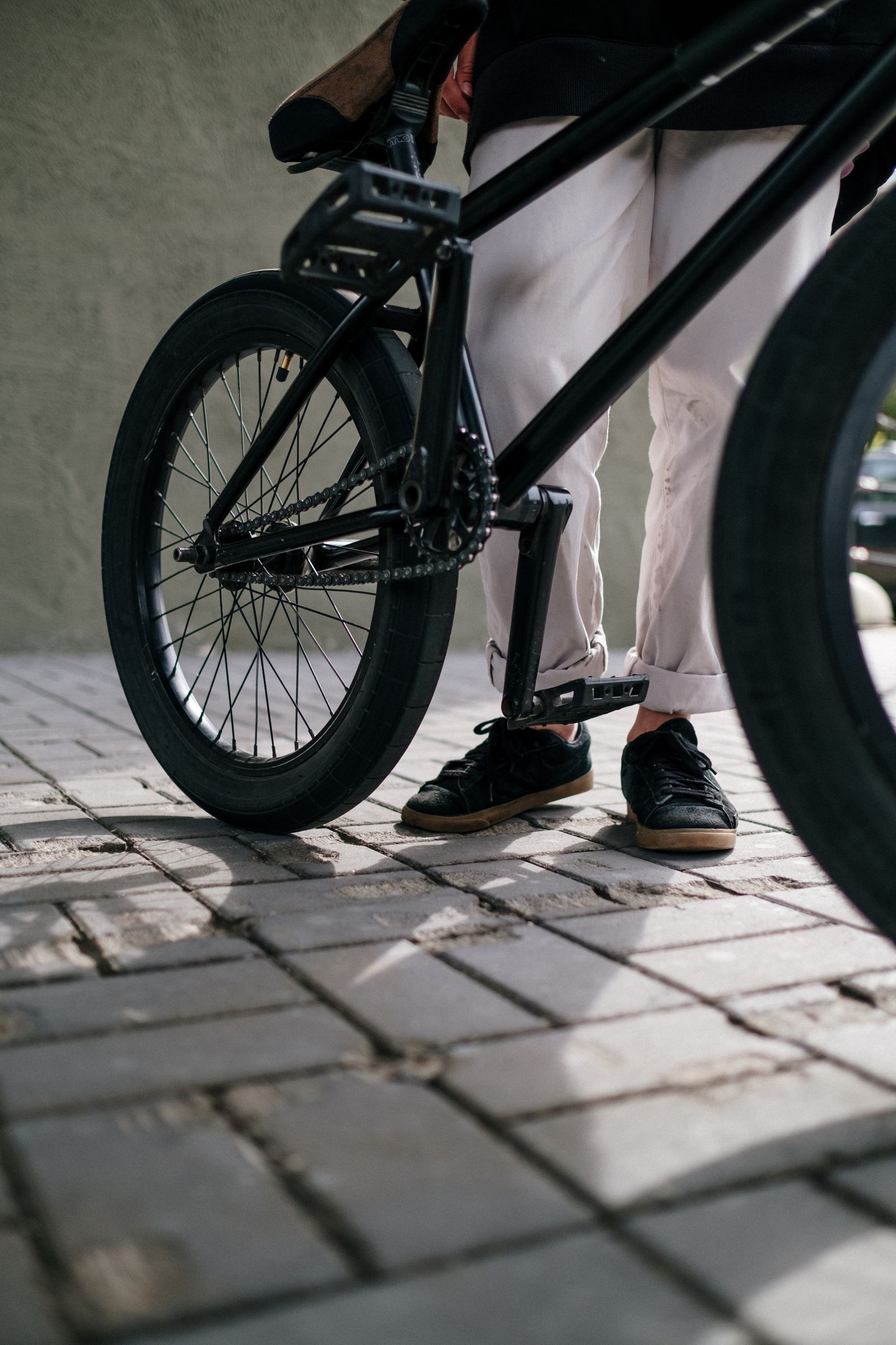 Cyclist preparing a bike near an outdoor trail