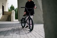 Man in Black Hoodie Riding on Black Bmx Bike