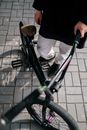 Person in Black Jacket Riding on Black Bicycle