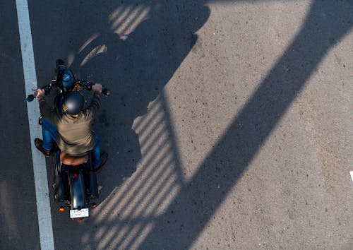 Top View of a Man in Helmet on a Motorbike