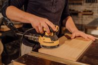 Man in Black T-shirt Holding Black and Yellow Cordless Power Drill