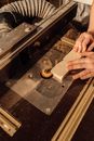 Person Holding Brown and Black Wooden Table