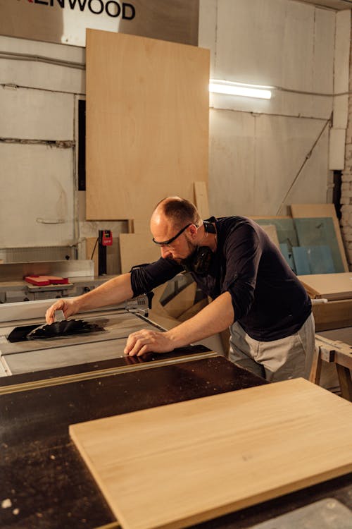 Carpenter cutting Wood Board 