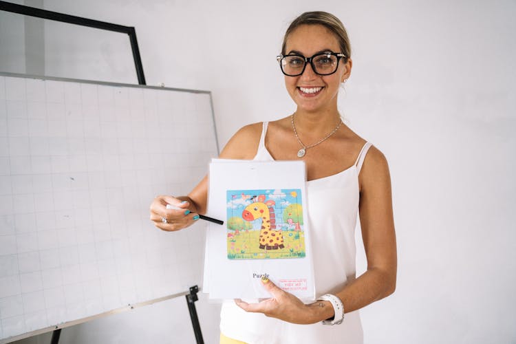 Teacher Holding Learning Materials