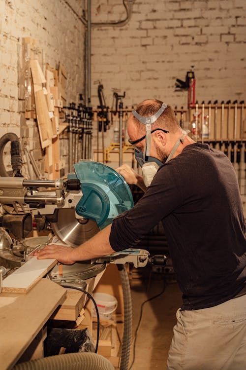 Woodworker using an Industrial Grinding Machine 