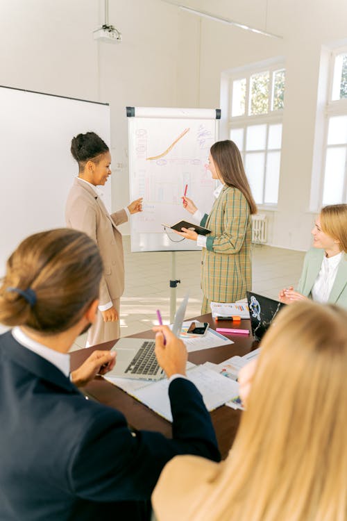 Free Women Having a Meeting in the Room Stock Photo